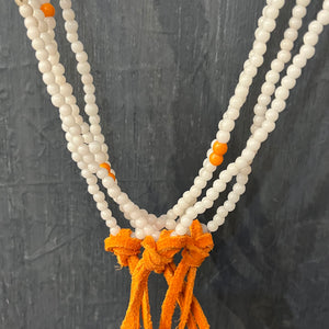 RTH LOVE KNOT NECKLACE - VTG ROUND OPAQUE WHITE WITH ORANGE SUEDE KNOT